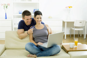 couple-sitting-looking-at-computer