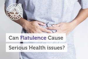 An individual holding their abdominal area. Flatulence is a normal part of digestion but it can be a serious health concern if in excess.