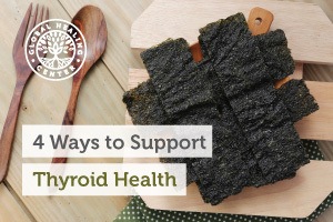 A layer of seaweed on a wooden platter. Try to drink fluoride-free water and go gluten-free to support thyroid health.
