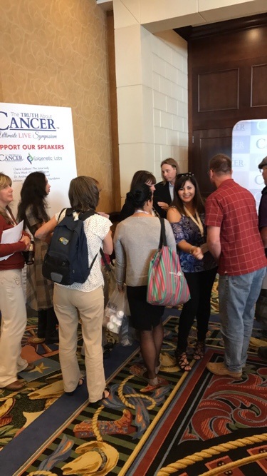 Dr. Group, DC meets with the audience members at the Truth About Cancer Symposium.