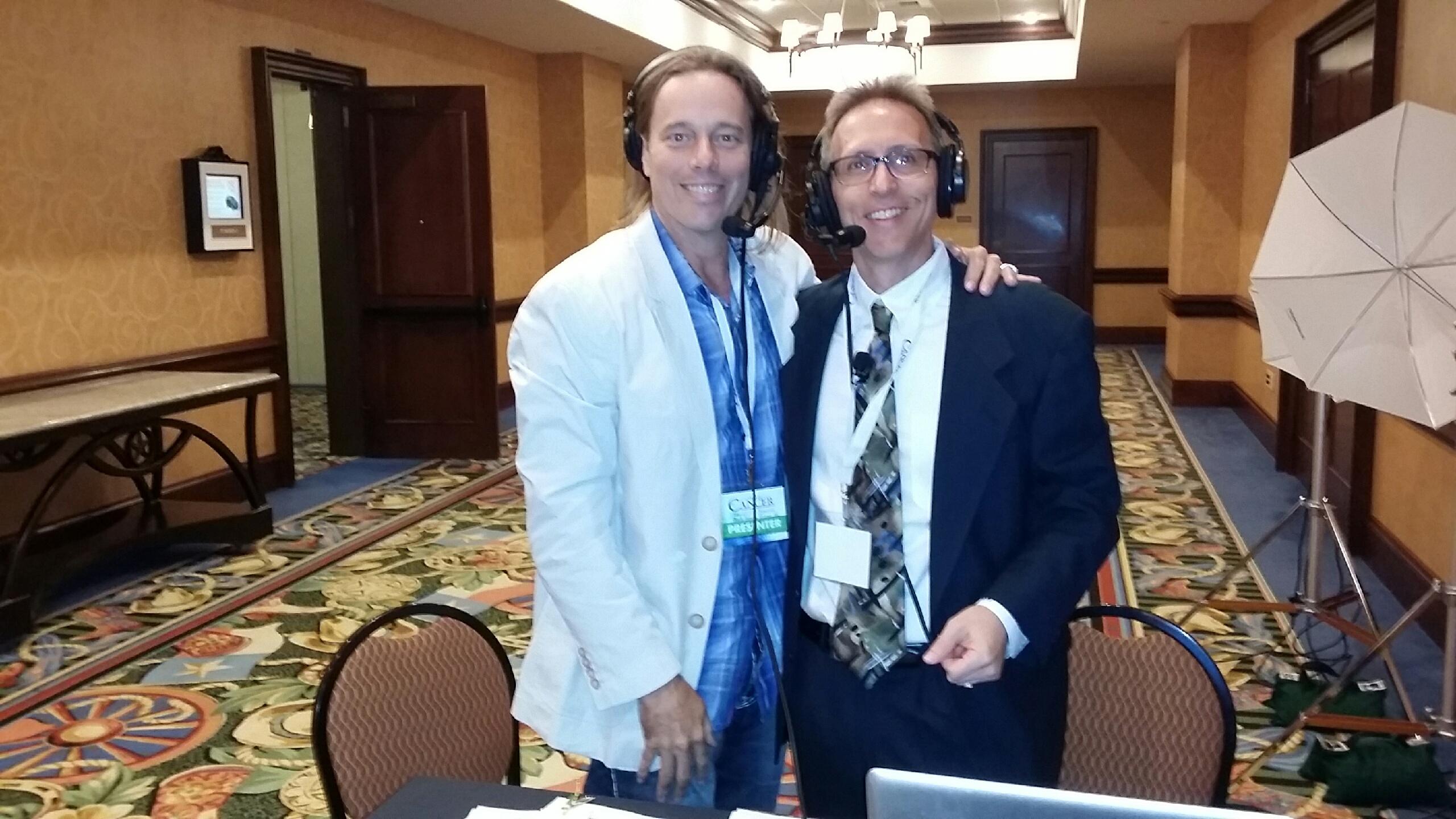 Dr. Group, DC with radio show host Scott Bell at The Truth About Cancer Symposium.