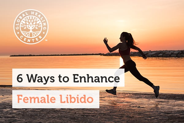 A woman is running on the beach. Exercising and having a healthy diet can help the female libido and your overall wellness.