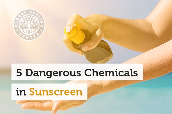 A person spraying sunscreen. Sunscreen contains a number of chemical ingredients that may actually be harmful to your health.