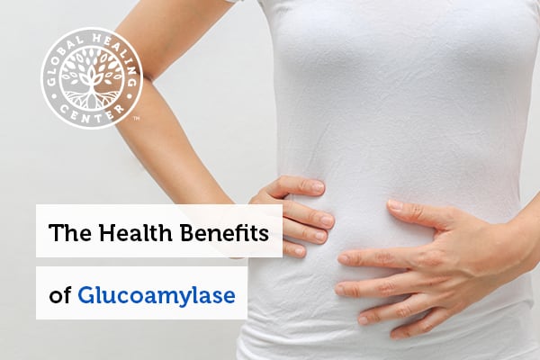 A women touching her stomach. Glucoamylase helps with digestion and digestion issues.